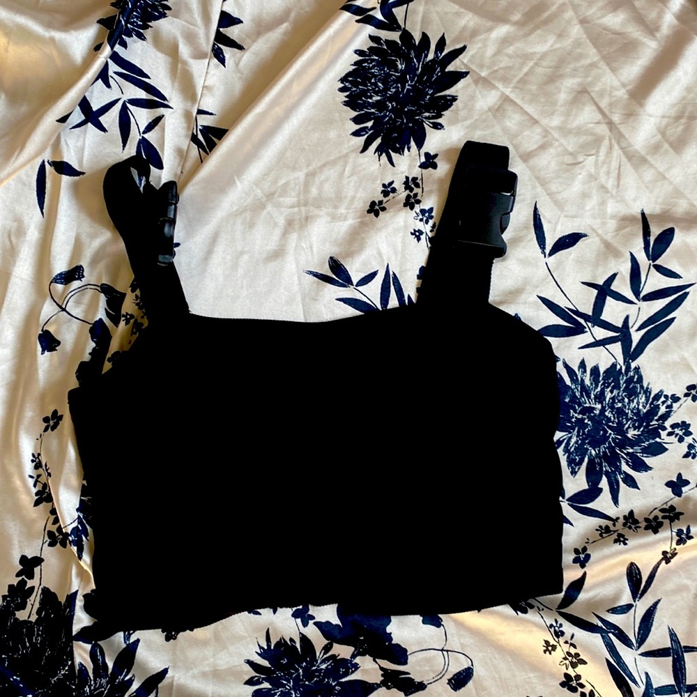 Crop top with buckle straps.